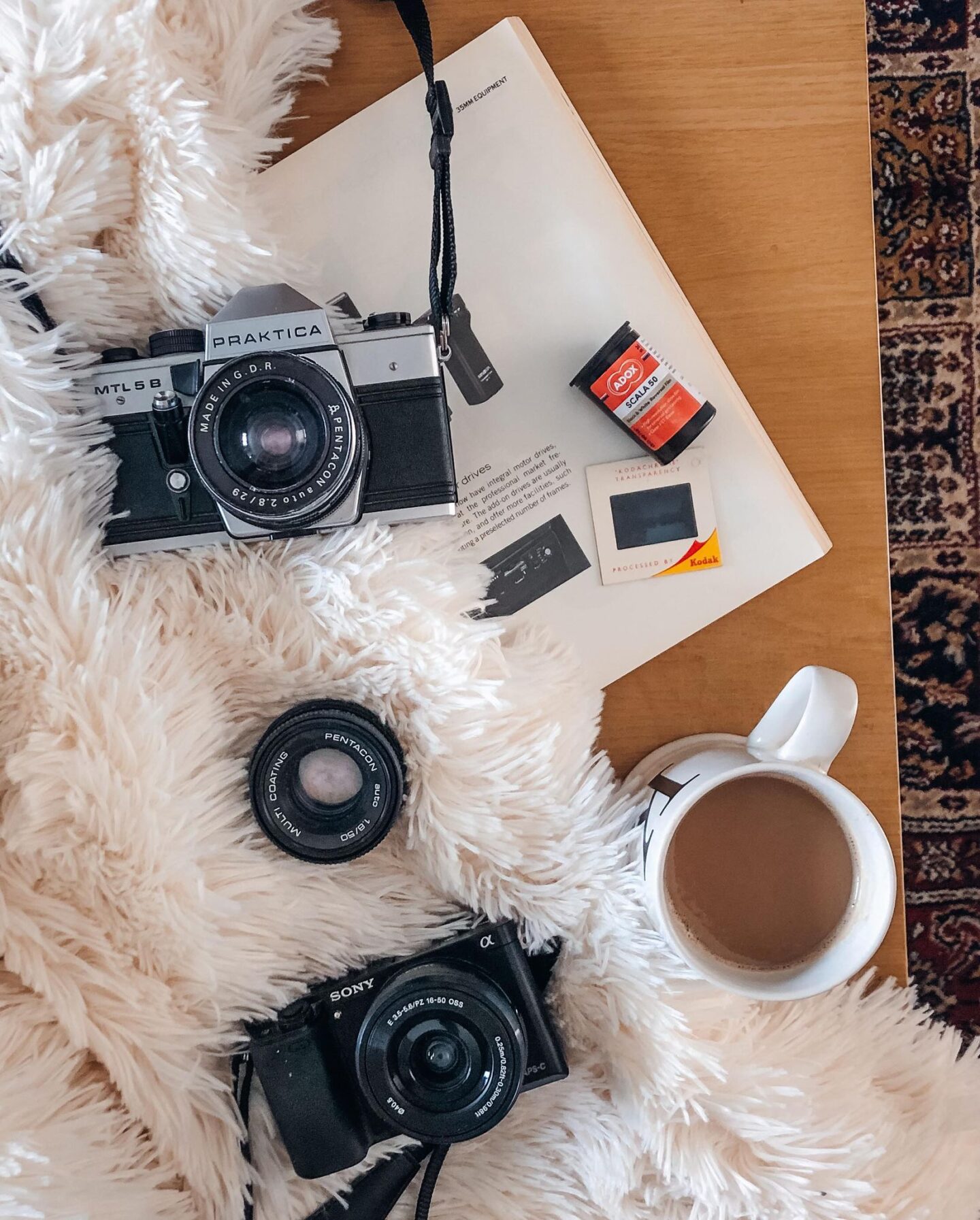 flatlay of digital and film camera